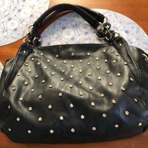 Black soho vegan leather shoulder bag with rhinestone front and padded straps.